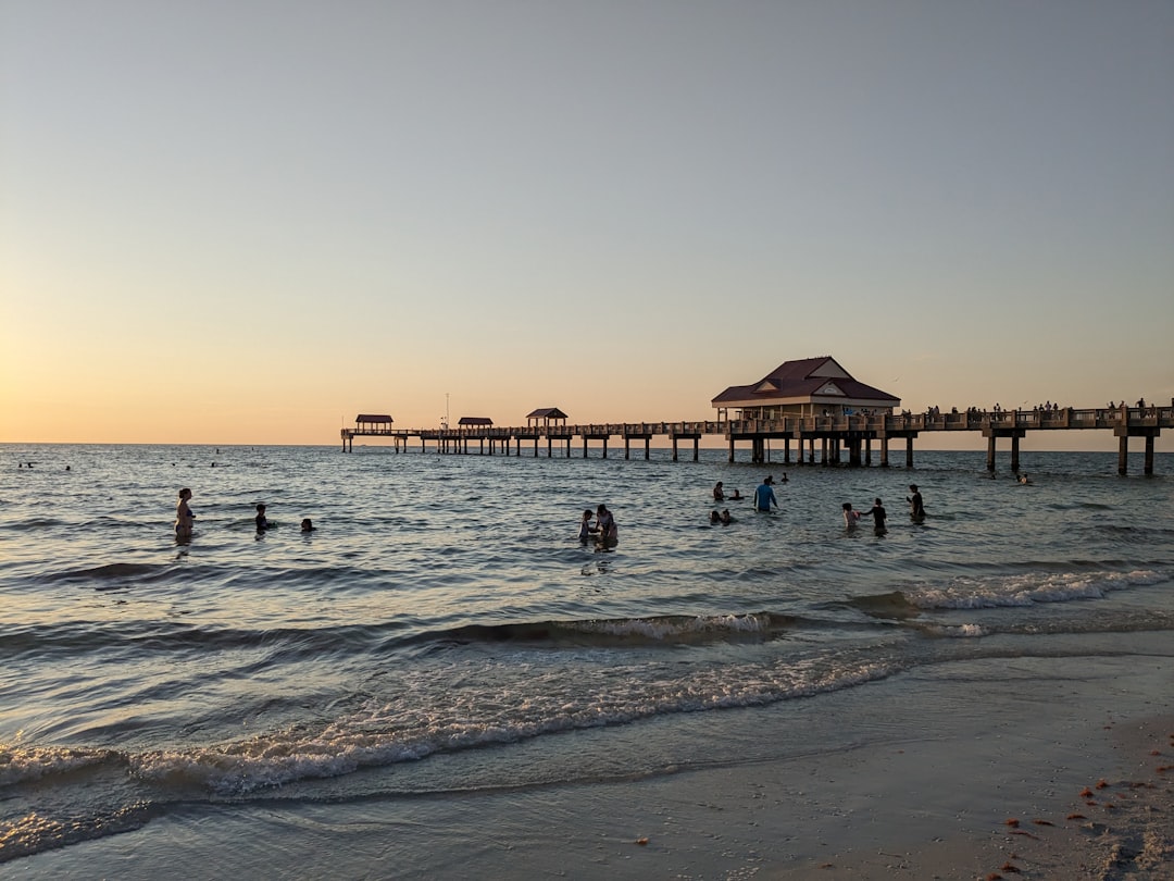Families in the shallow water beside Pier 60 at Clearwater Beach, Florida