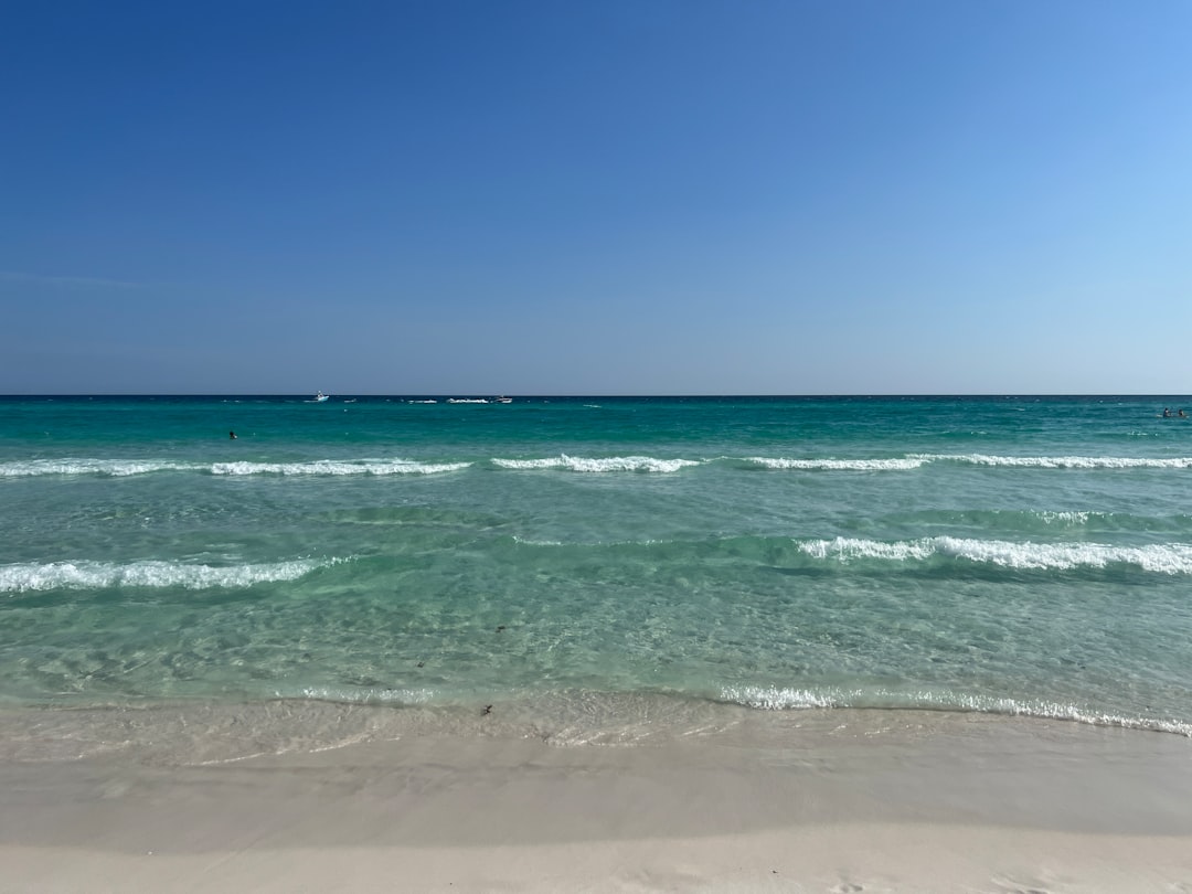 Gentle waves rolling onto the shore in the emerald Gulf water at Destin, Florida