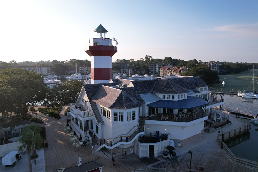 The Harbour Town Lighthouse above the marina and resort buildings on Hilton Head Island, South Carolina