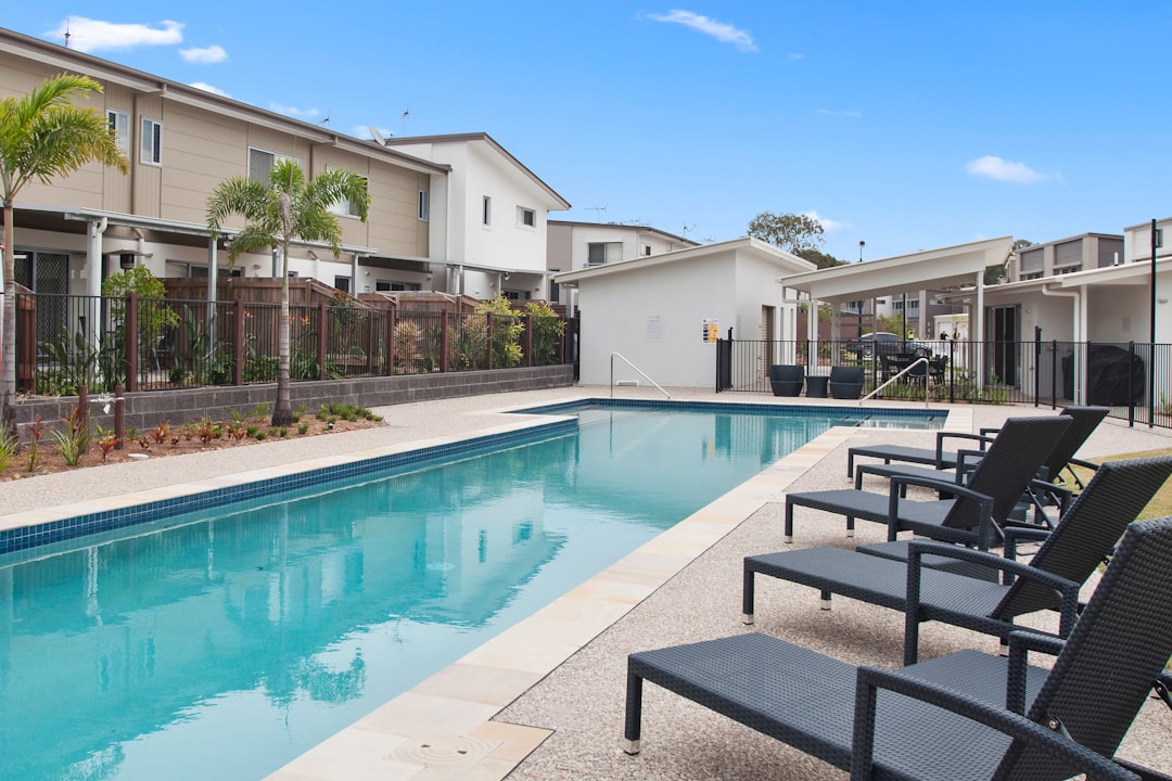 loungers near swimming pool