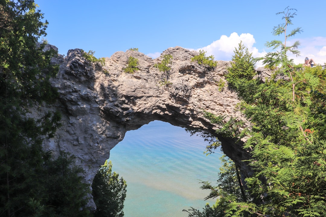 Arch Rock above the turquoise water of Mackinac Island, Michigan
