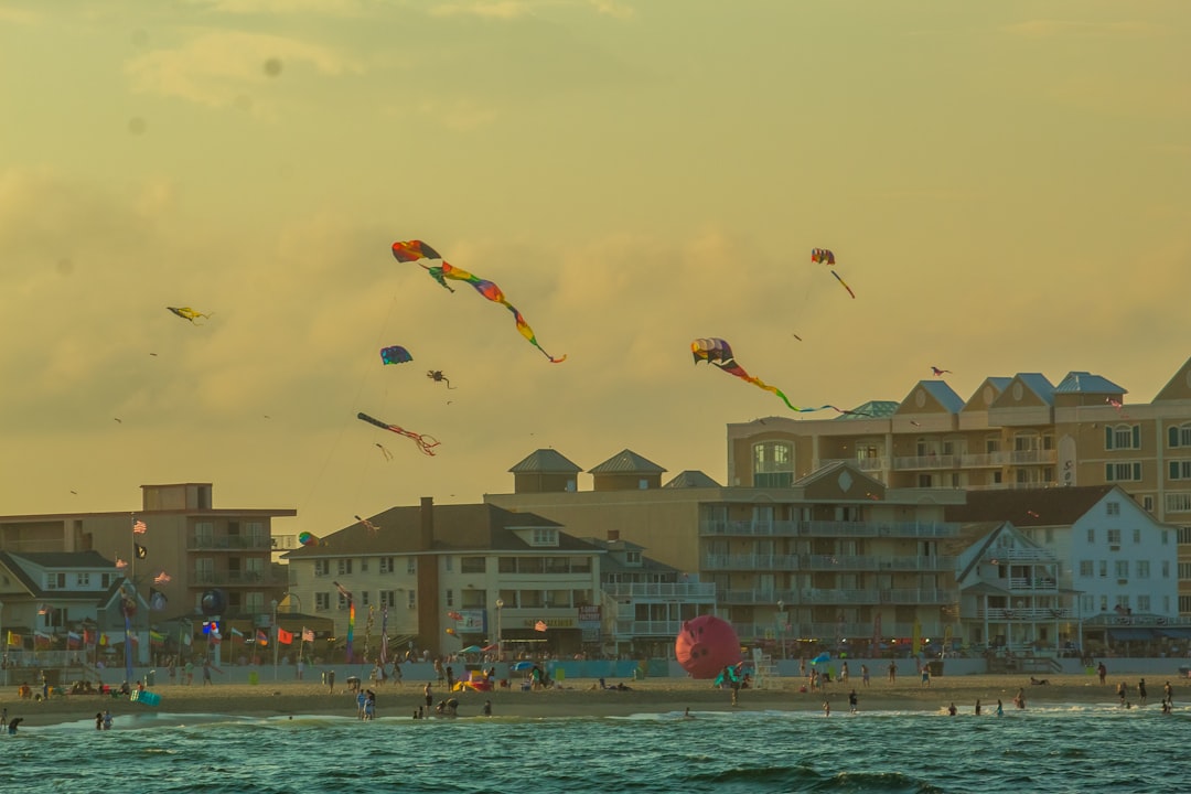 Kites flying above the buildings on the boardwalk at Ocean City, Maryland