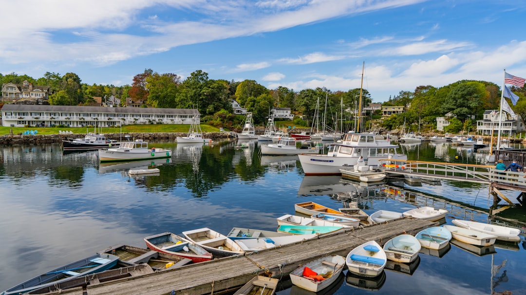 Perkins Cove harbor with boats and an inn in Ogunquit, Maine