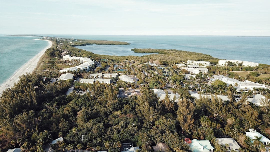 Aerial view of the tree-covered island and shoreline at Sanibel Island, Florida