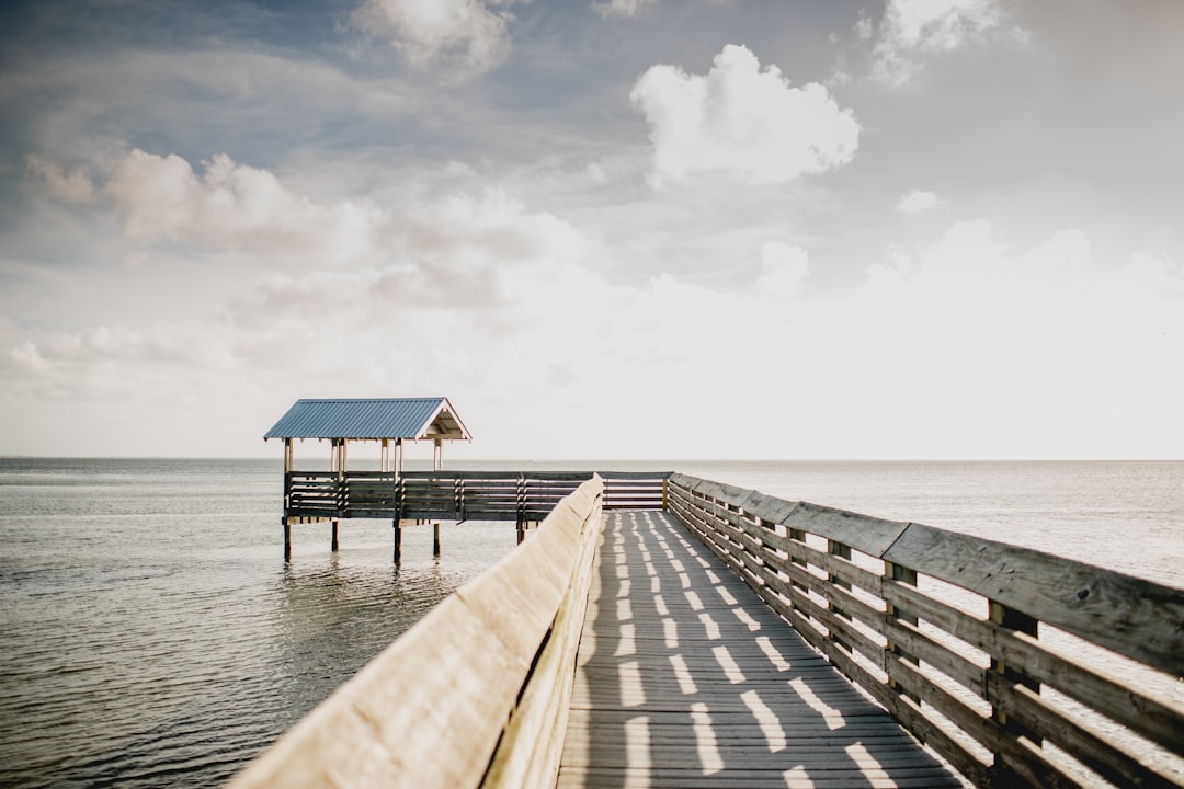 A fishing pier over calm water at South Padre Island, Texas