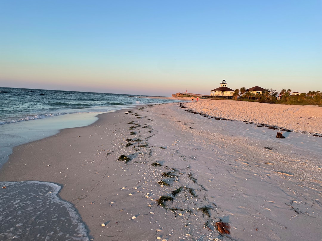 The lighthouse and shoreline at St. George Island, Florida at sunset