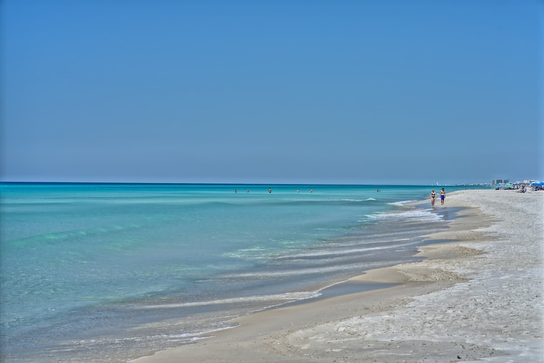 Calm, shallow Gulf water on the white sand at St. George Island, Florida