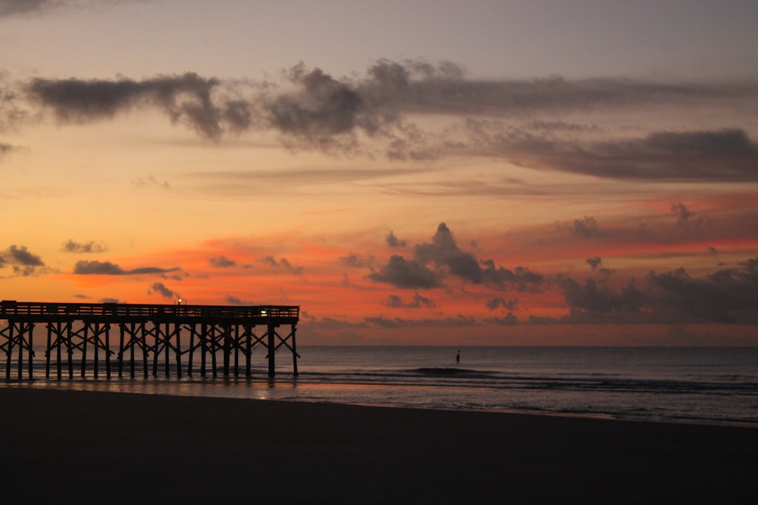 The pier silhouetted against a sunset sky at Isle of Palms, South Carolina