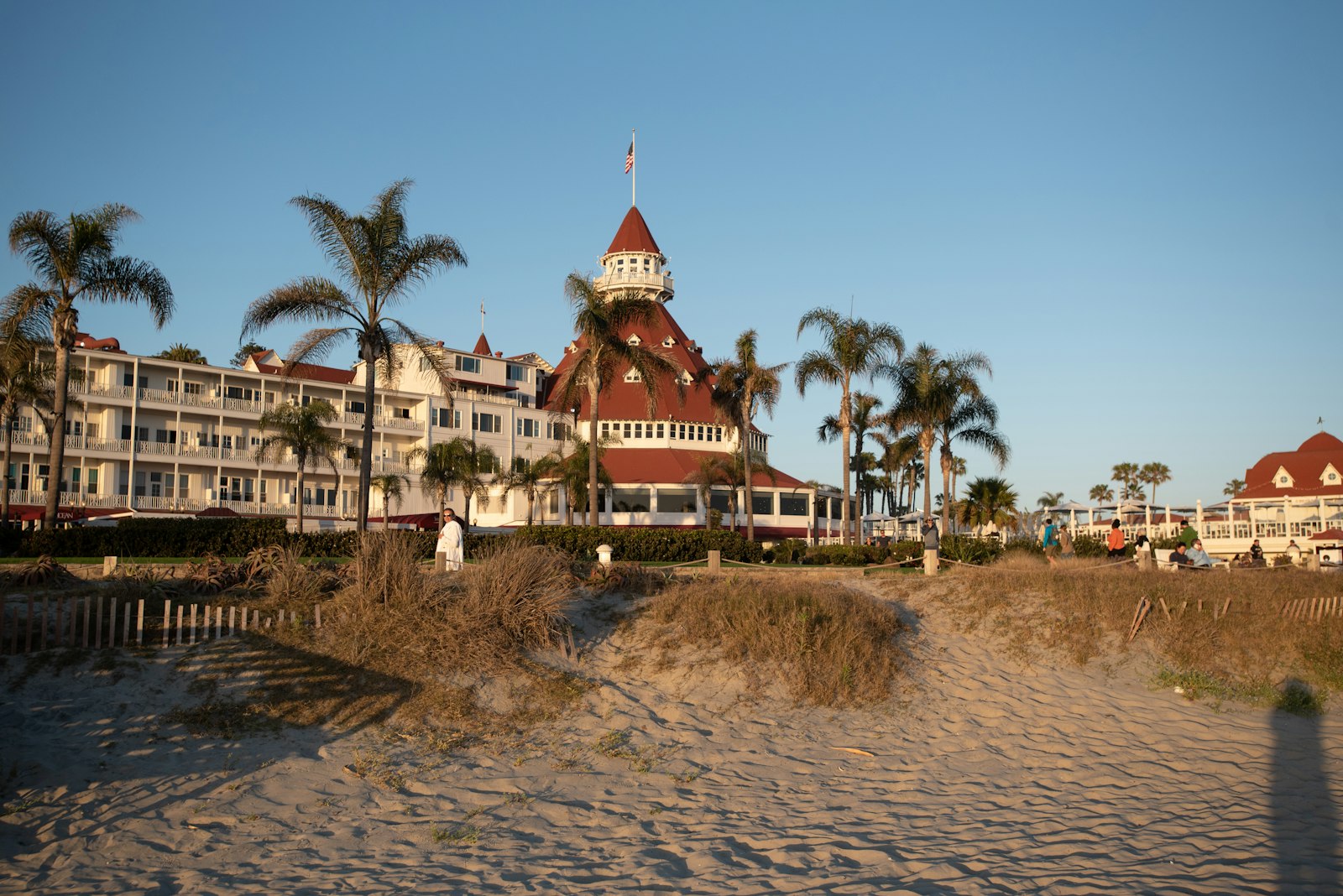 The Hotel del Coronado and its red turret behind the sand at Coronado, California