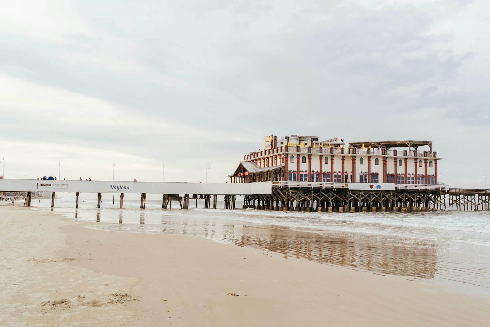 The Daytona Beach Pier over the hard-packed sand in Florida