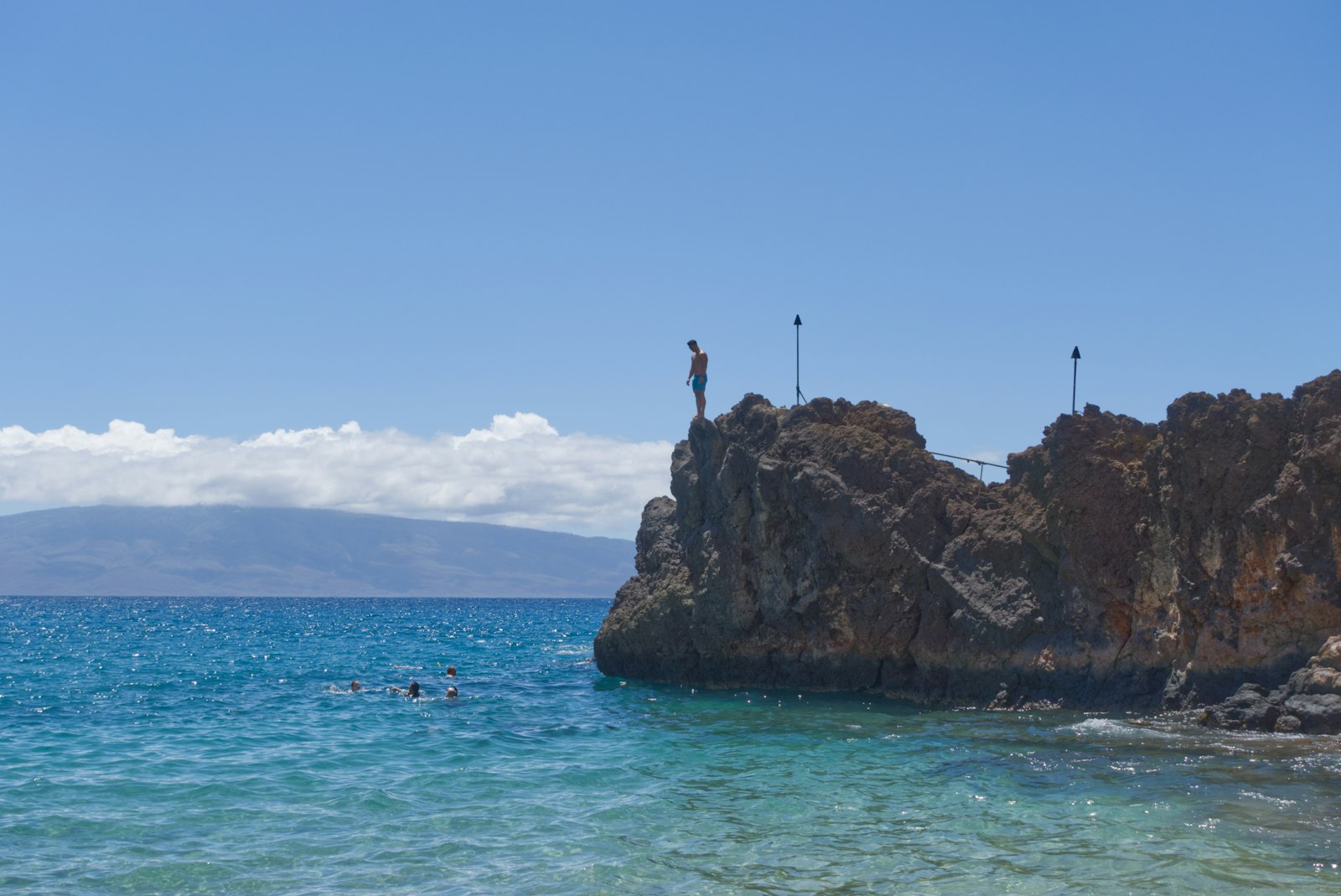 Swimmers below Black Rock at Kaanapali Beach on Maui, Hawaii